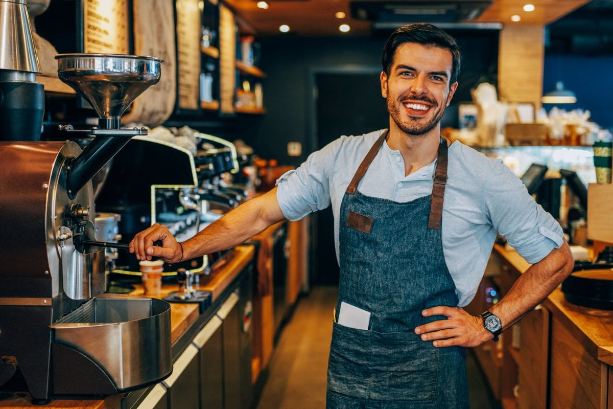 young man working as a barista